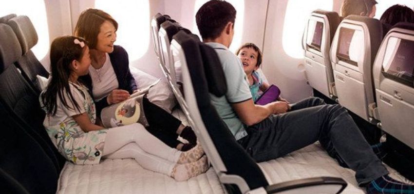 Passengers sitting in their aeroplane seat